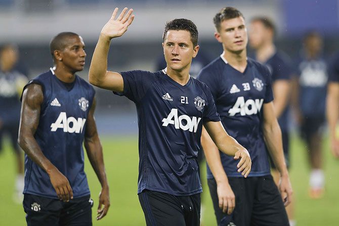 Manchester United's Ander Herrera waves to fans