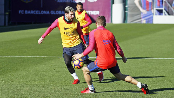FC Barcelona's Lionel Messi trains during a practice session in Barcelona on Friday
