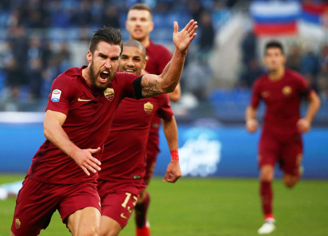 AS Roma's Kevin Strootman (left) celebrates after scoring against Lazio during their Serie A match on Sunday