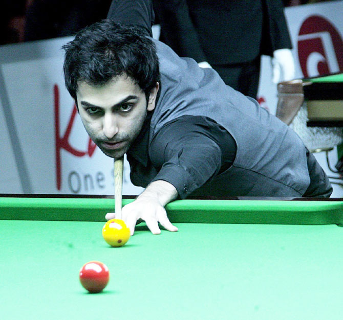 Indian cuiest Pankaj Advani plays a shot during the IBSF World Billiards Championship quarter-final in the 500 long-up format in Bengaluru on Wednesday