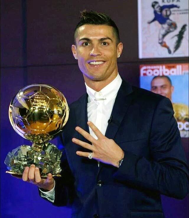 Cristiano Ronaldo poses with the Ballon d'Or trophy