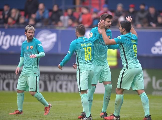 FC Barcelona's Luiz Suarez, Gerard Pique, Lionel Messi and Jordi Alba celebrate a goal against Osasuna during their La Liga match on Saturday