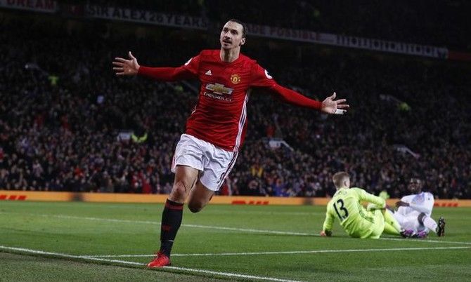 Manchester United's Zlatan Ibrahimovic celebrates scoring their second goal as Sunderland's Jordan Pickford looks dejected