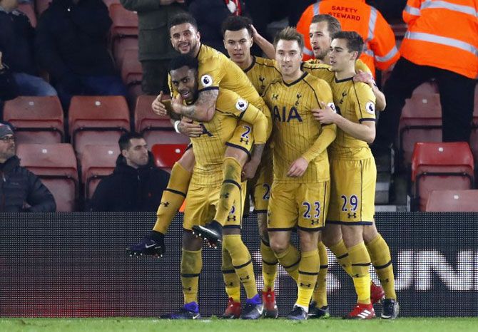 Tottenham's Dele Alli celebrates scoring their fourth goal with teammates against Southampton during their Premier League match St Mary's Stadium on Wednesday