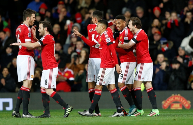 Anthony Martial celebrates scoring the second goal for Manchester United with teammates 