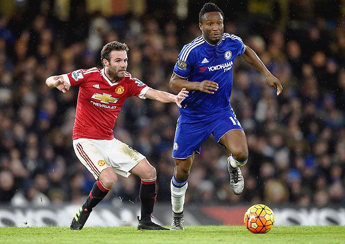 Manchester United's Juan Mata closes down Chelsea's John Obi Mikel during their Barclays Premier League match at Stamford Bridge in London on Sunday