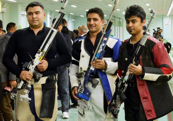 Gold medalist Chain Singh (centre) of India, and bronze medalist Gagan Narang (left) 
