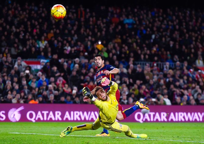 FC Barcelona's Luis Suarez scores his team's second goal past Celta Vigo's 'keeper Sergio Alvarez during their La Liga match at Camp Nou in Barcelona on Sunday
