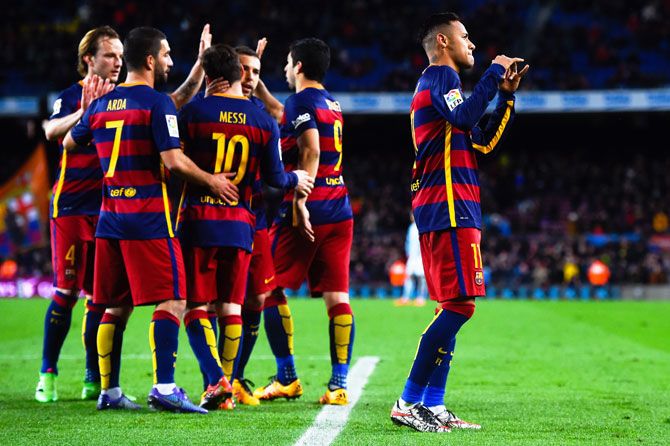 FC Barcelona's Neymar (right) celebrates with his teammates after scoring