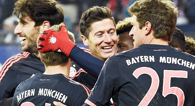 Bayern Munich's Robert Lewandowski celebrates with teammates after scoring a goal