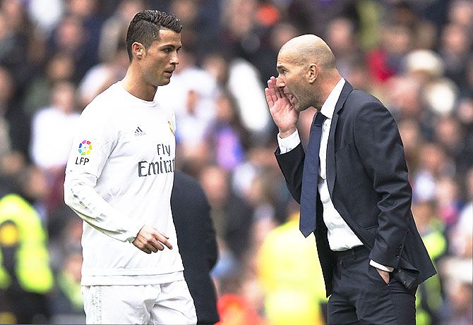 Real Madrid coach Zinedine Zidane (right) gives instructions to Cristiano Ronaldo