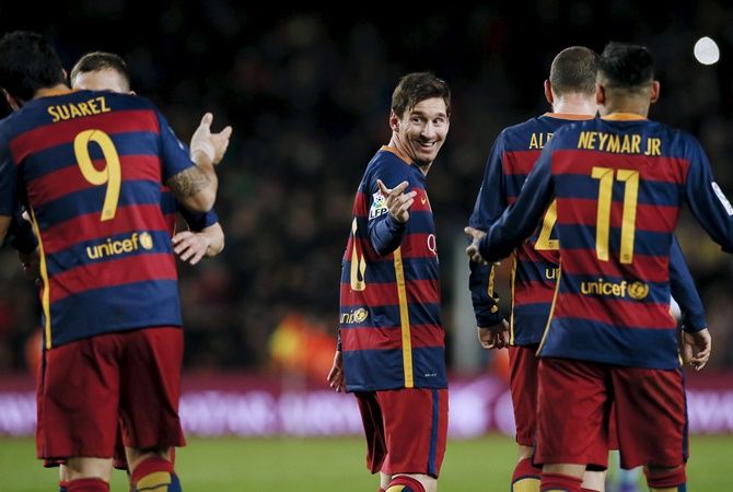 Barcelona's Lionel Messi, centre, gestures 