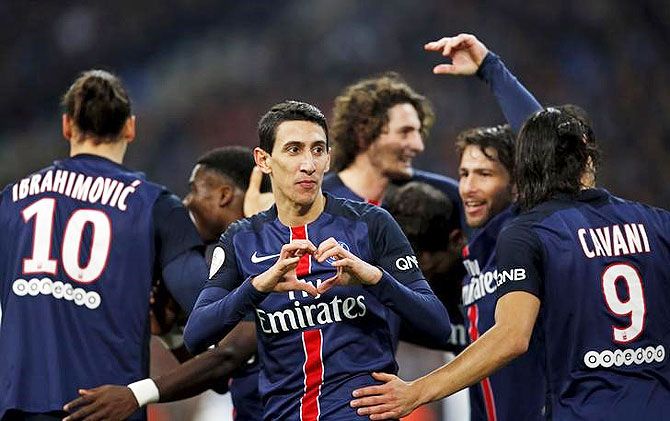 Paris St Germain's Angel Di Maria (centre) reacts after scoring against Olympique Marseille