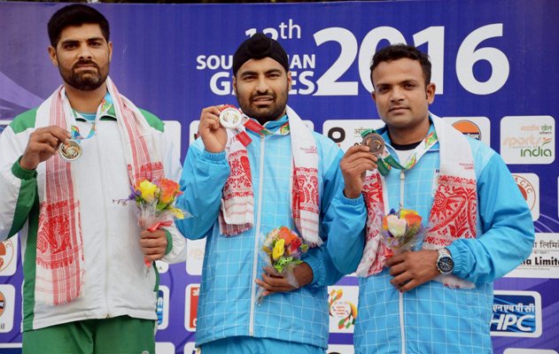 Gold medal winner Gurpreet Singh (center) 