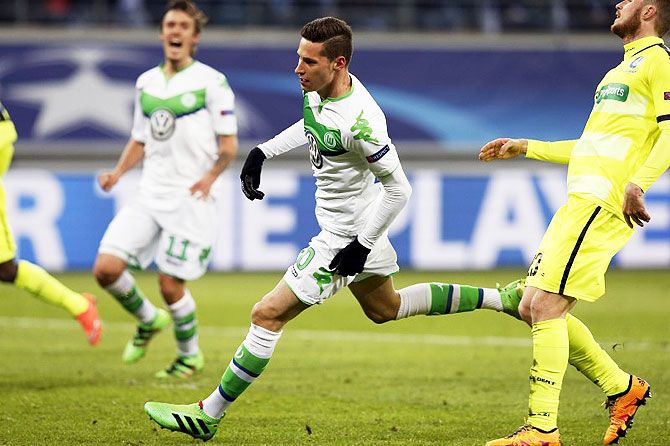 VfL Wolfsburg's Julian Draxler celebrates after scoring against Gent during their UEFA Champions League round of 16 first leg match at Ghelamco Arena in Belgium on Wednesday