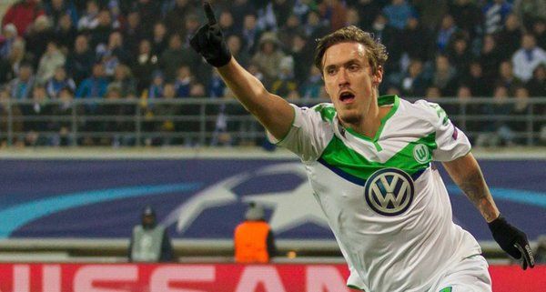Wolfsburg's Max Kruse celebrates after scoring the third goal against Gent