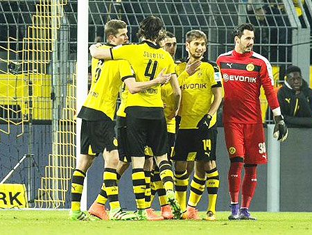 Borussia Dortmund players celebrate their victory over Hoffenheim after their Bundesliga match on Sunday