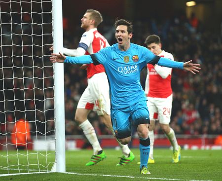 FC Barcelona's Lionel Messi celebrates after scoring against Arsenal in their Champions League round of 16, first leg tie at the Emirates Stadium on Tuesday