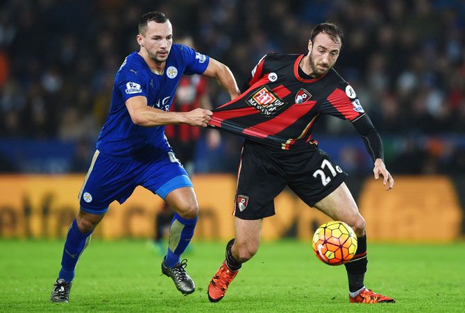 Bournemouth's Glenn Murray and Leicester City's Danny Drinkwater compete for the ball during their match at The King Power Stadium in Leicester