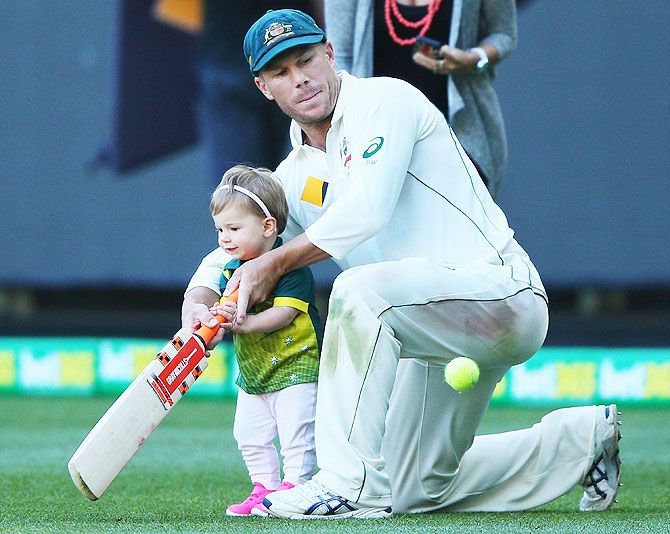 Australia's David Warner plays with his daughter Ivy on Day 4 of the Second Test match between Australia and the West Indies at Melbourne Cricket Ground on December 29, 2015