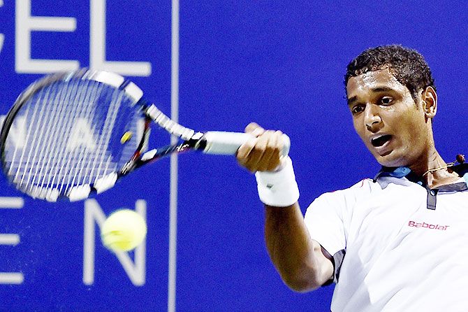 India's Ramkumar Ramanathan in action against Spain Gimeno Traver during their first round match at the ATP Chennai Open 2016 on Tuesday