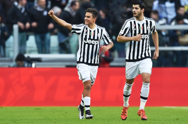 Paulo Dybala (left) of Juventus celebrates after scoring the opening goal 