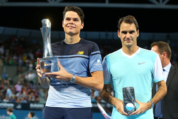 Milos Raonic of Canada holds the winners trophy  