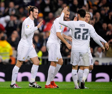 Gareth Bale of Real Madrid (left) celebrates with teammates 