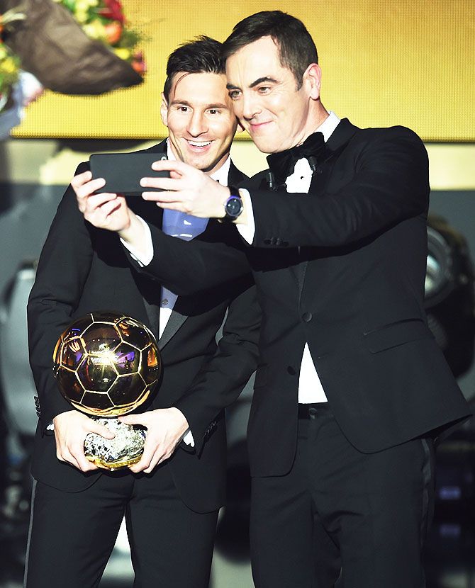 Lionel Messi poses for a selfie with host James Nesbitt