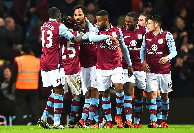 Aston Villa's Joleon Lescott (3rd from left) celebrates with teammates as he scores their first goal against Crystal Palace at Villa Park