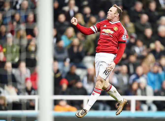 Manchester United's Wayne Rooney celebrates as he scores their third goal during the Barclays Premier League match against Newcastle United at St James' Park at Newcastle upon Tyne on Tuesday