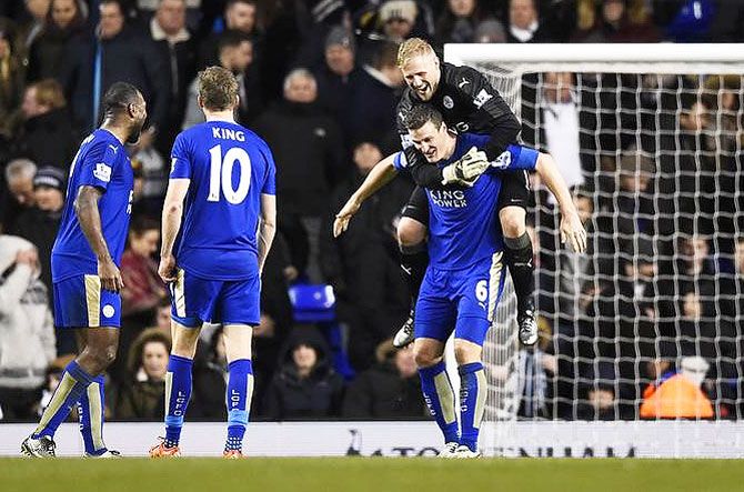 Leicester City's Kasper Schmeichel and Robert Huth celebrate after beating Spurs on Wednesday