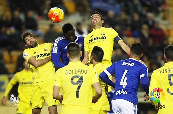 Players from Real Betis and Villareal vie for possession
