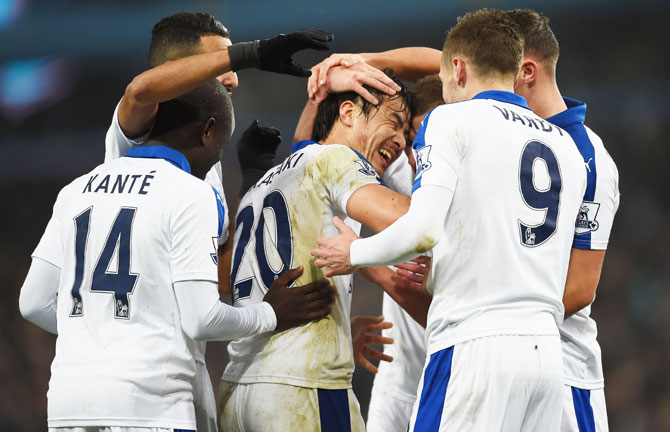 Leicester City's Shinji Okazaki (centre) celebrates with his teammates after scoring against Aston Villa during their Barclays Premier League match at Villa Park in Birmingham on Saturday