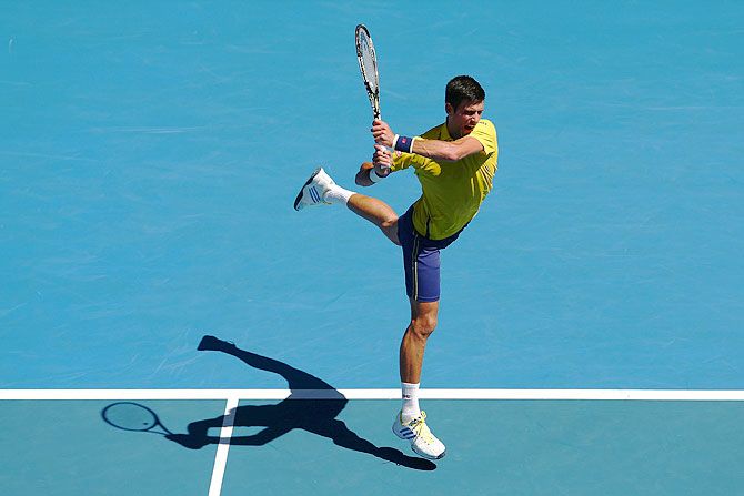 Serbia's Novak Djokovic plays a backhand in his first round match against South Korea's Hyeon Chung during first round match at the 2016 Australian Open at Melbourne Park on Monday