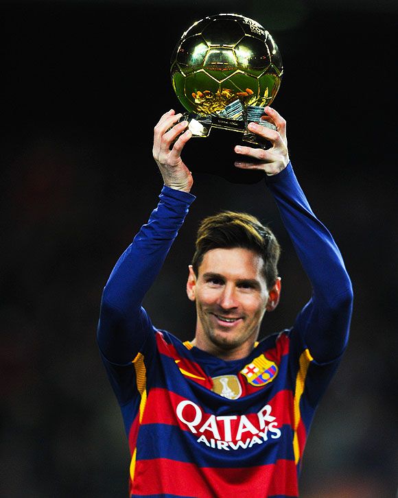 FC Barcelon's Lionel Messi holds up the FIFA Ballon d'Or trophy prior to the La Liga match against Athletic Club de Bilbao at Camp Nou on Sunday