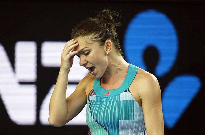 Romania's Simona Halep reacts after losing a point during her first round match against China's Zhang Shuai