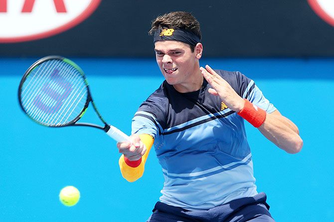 Canada's Milos Roanic plays a forehand in his first round match against France's Lucas Pouille