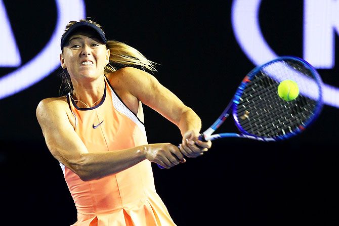 Russia's Maria Sharapova plays a backhand in her second round match against Belarus's Aliaksandra Sasnovich at the 2016 Australian Open at Melbourne Park on Wednesday