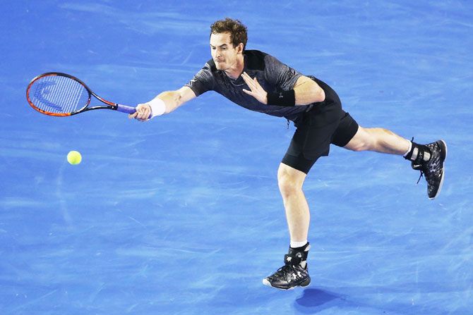 Great Britain's Andy Murray plays a forehand in his fourth round match against Australia's Bernard Tomic