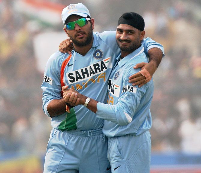 Yuvraj Singh (left) with teammate Harbhajan Singh