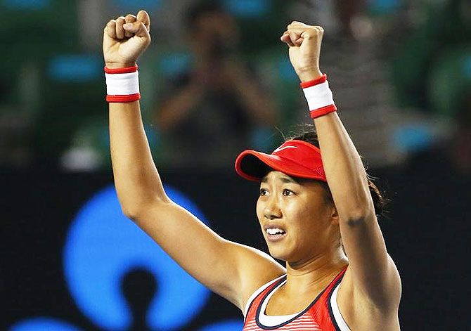 China's Zhang Shuai celebrates after winning her fourth round match against Madison Keys of the US