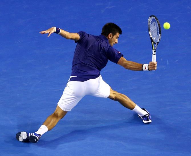 Novak Djokovic in action during his semi-final match against Roger Federer at the Australian Open. Photograph: Scott Barbour/Getty Images