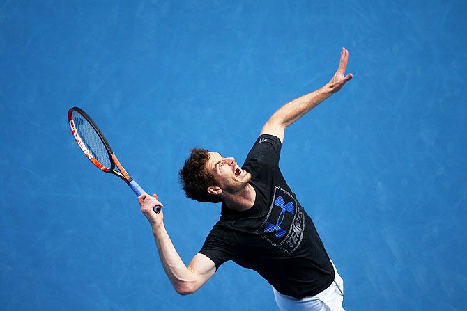 Andy Murray of Great Britain serves in a practice session on Saturday