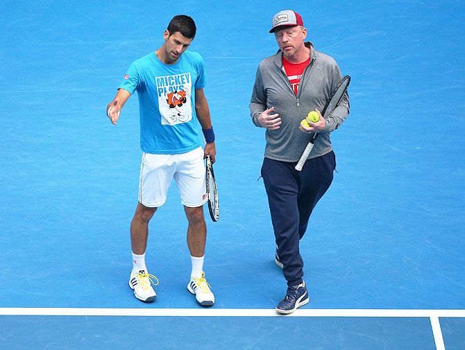 Serbia's Novak Djokovic and coach Boris Becker at a practice session at Melbourne Park on Saturday