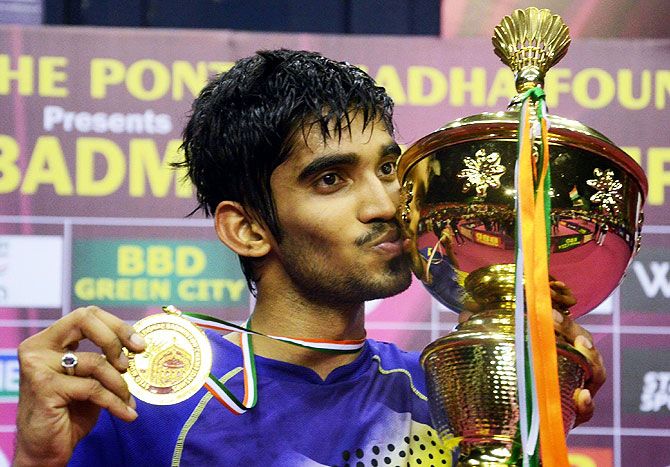 Indian shuttler K. Srikanth with Syed Modi grand prix trophy after beating Chinese player Huang Yuxiang in Lucknow on Sunday