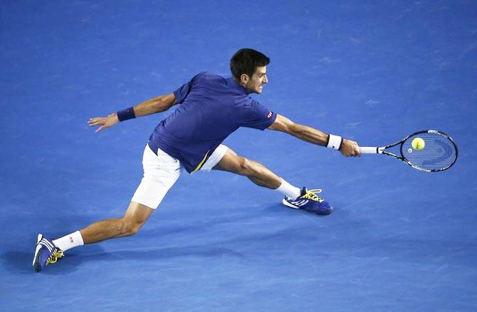 Novak Djokovic stretches for a shot