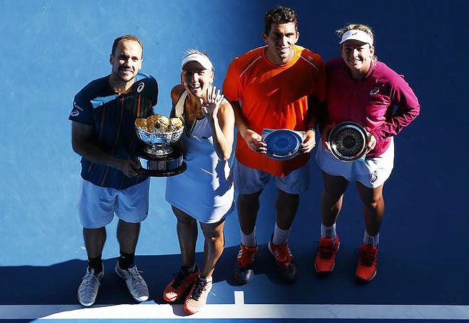 Brazil's Bruno Soares (left-right) and Russia's Elena Vesnina pose with the mixed doubles trophy beside runners-up Romania's Horia Tecau and Coco Vandeweghe of the US