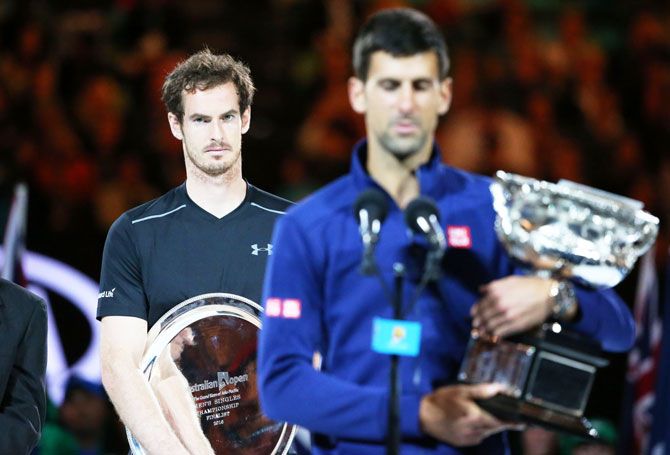 Australian Open champion Novak Djokovic of Serbia speaks as Andy Murray looks on after the final on Sunday