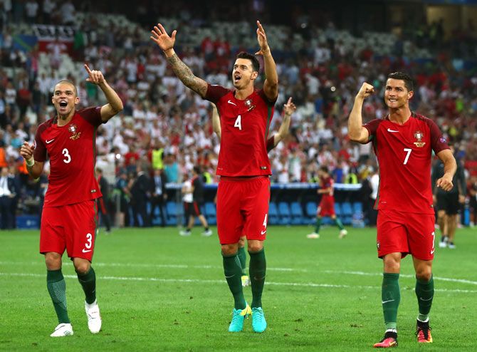 Pepe, Jose Fonte and Cristiano Ronaldo of Portugal celebrate their team's win